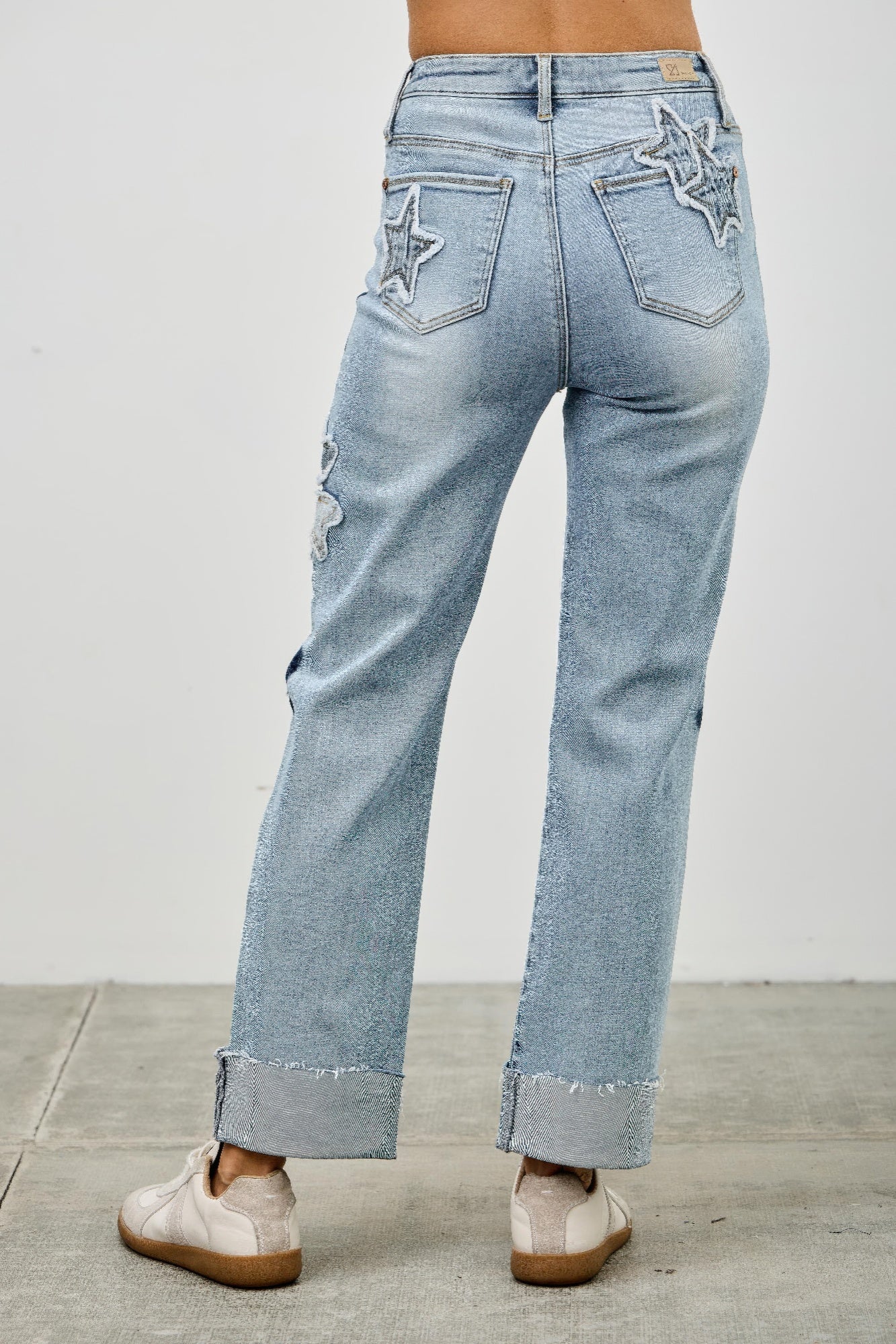 High-rise stretch dad jeans with star patches on both front pockets