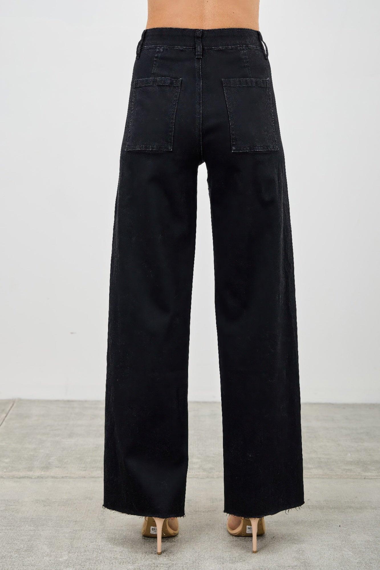 High-rise straight jeans in dark wash, wide leg, back view with two patch pockets