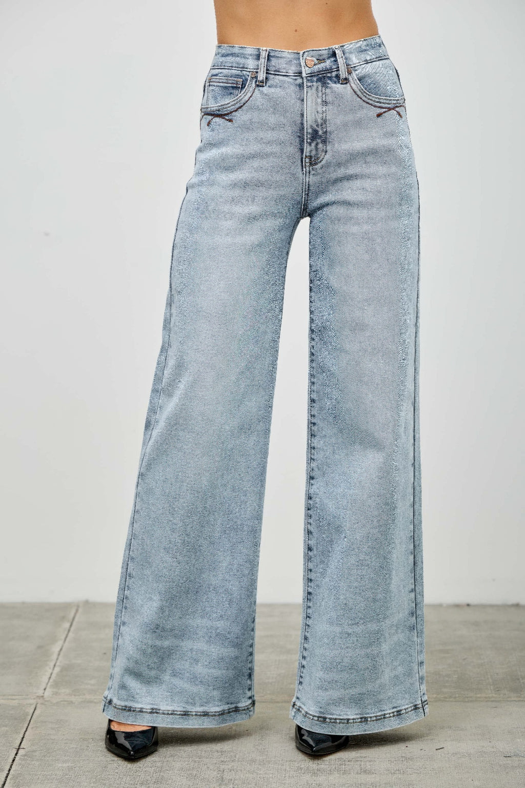 High rise wide-leg jeans front view, light blue denim with high waistband and button