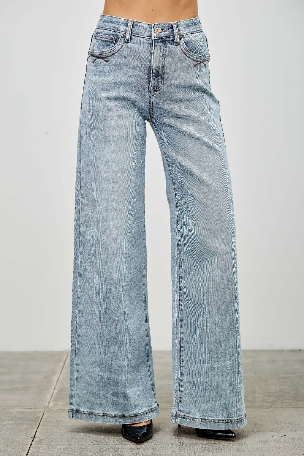 High rise wide-leg jeans back view, light blue denim with back yoke and stitched seams