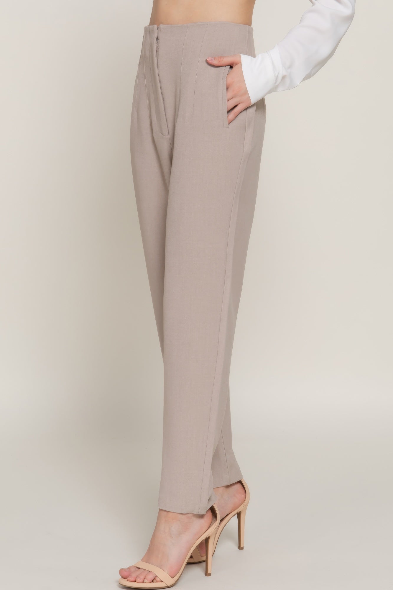 High-waist long pants in heather taupe, side view with pintuck detail