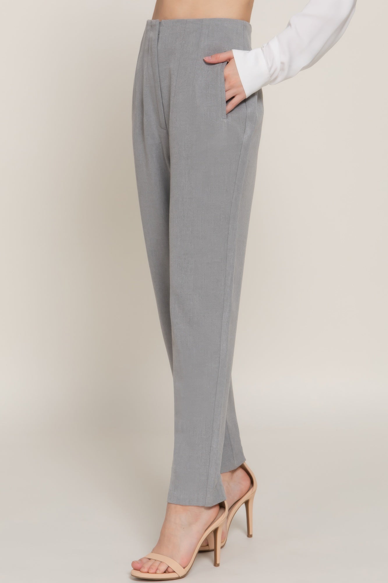High-waist long pants in heather grey, side view with pintuck detail