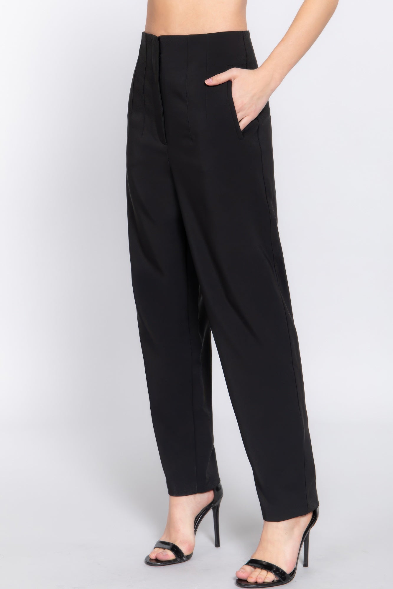 Black high-waist long pants with pintuck detail, side view and ankle hem