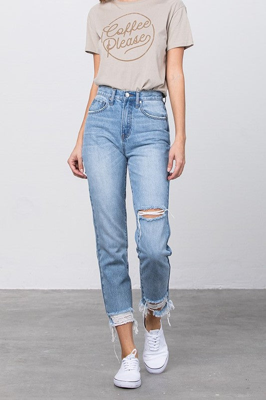 High-waist tapered jeans with knee rip and frayed ankle hem in medium wash