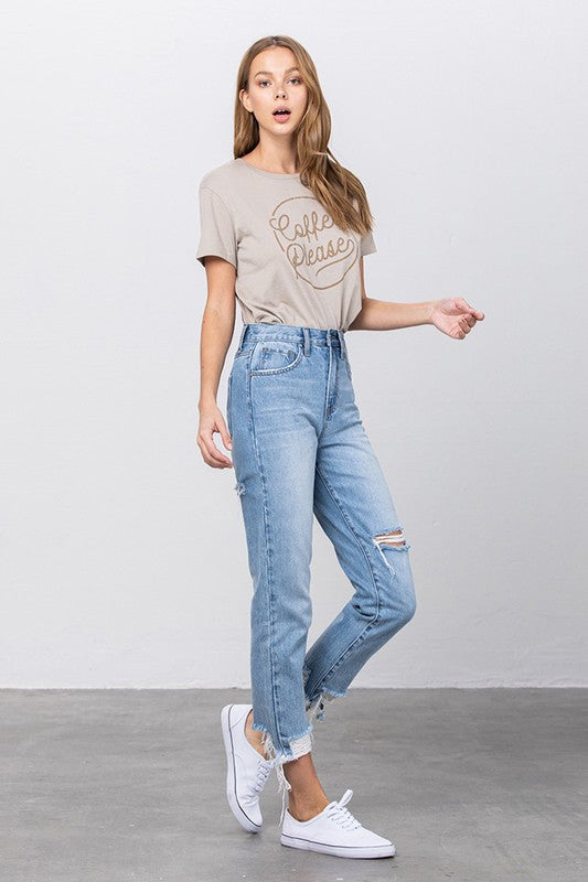 High-waist tapered ripped jeans in medium wash with frayed ankle cuffs
