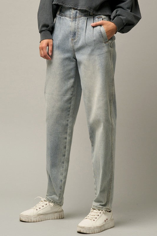 Light high-waisted balloon jeans, side view with subtle wash and straight seams