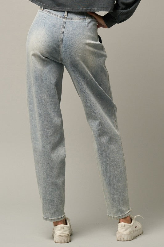 Light high-waisted balloon jeans, front view showing relaxed thigh and taper to hem