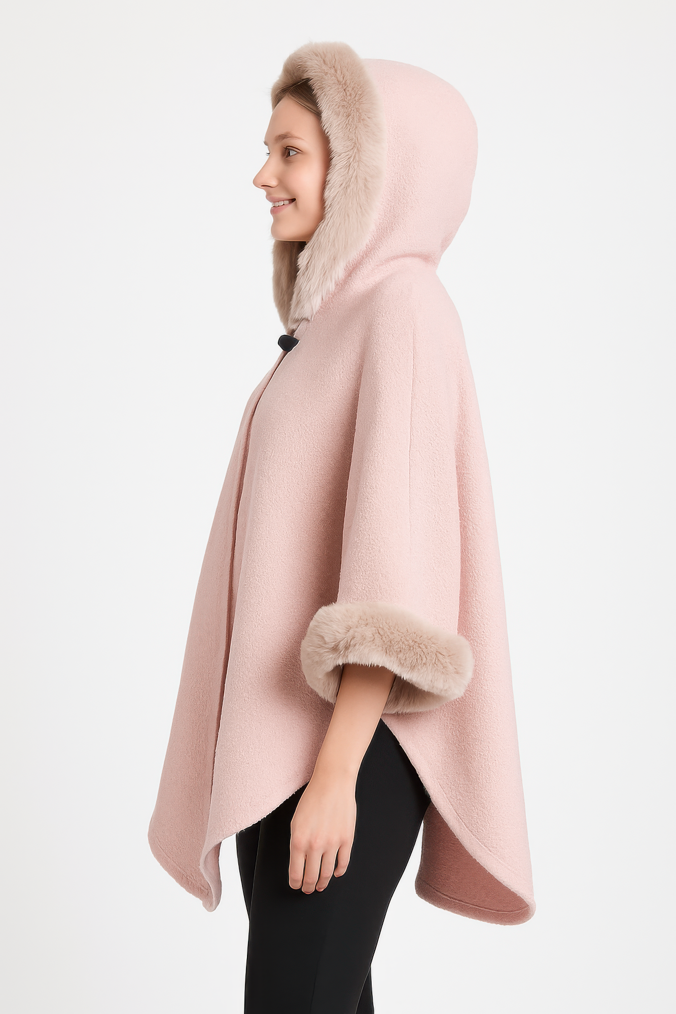 Pink hooded cape side view with faux fur sleeve cuffs and draped hem