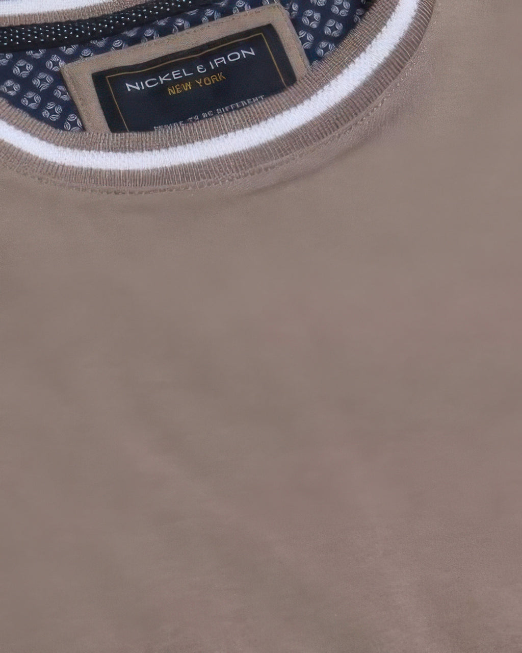 Neckline label and ribbed crew collar on taupe-brown Interlock Crew Tee