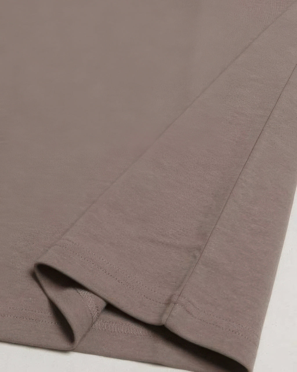 Taupe-brown crew tee fabric and side seam detail with double-stitched hem