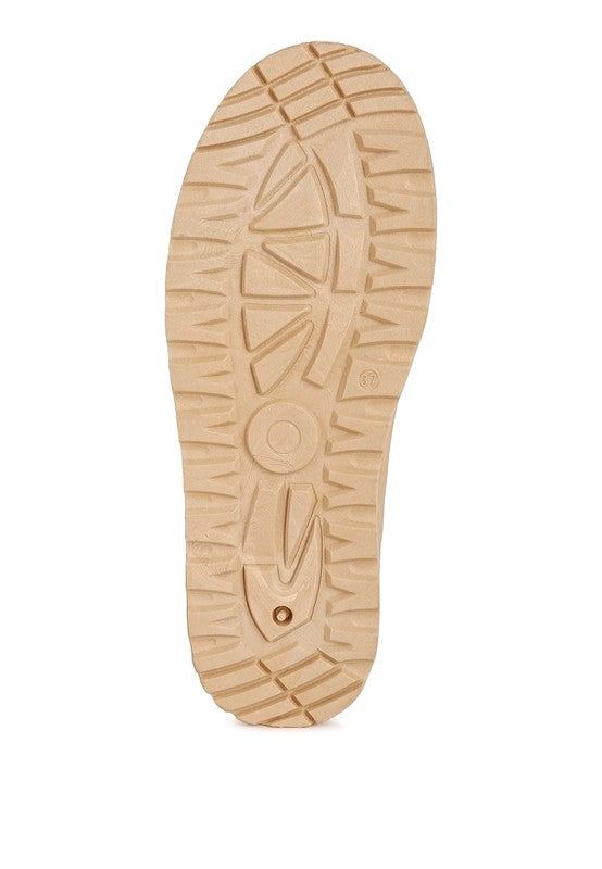 Beige platform shoe outsole with deep tread pattern