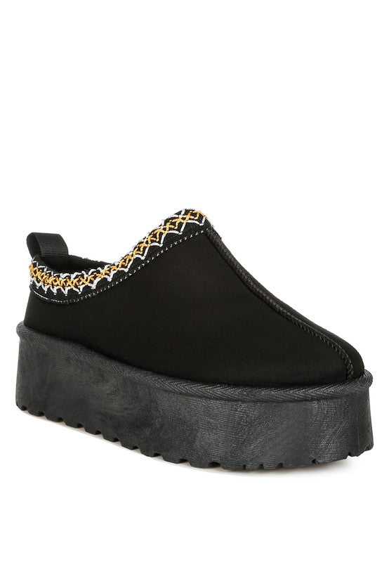 Black jester-embroidered slip-on platform shoe with decorative trim