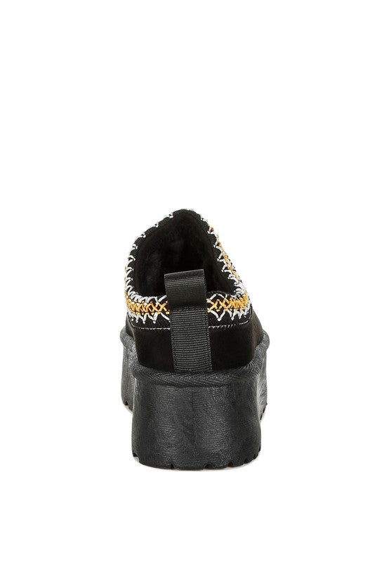 Black platform slip-on heel with pull loop strap and jester trim