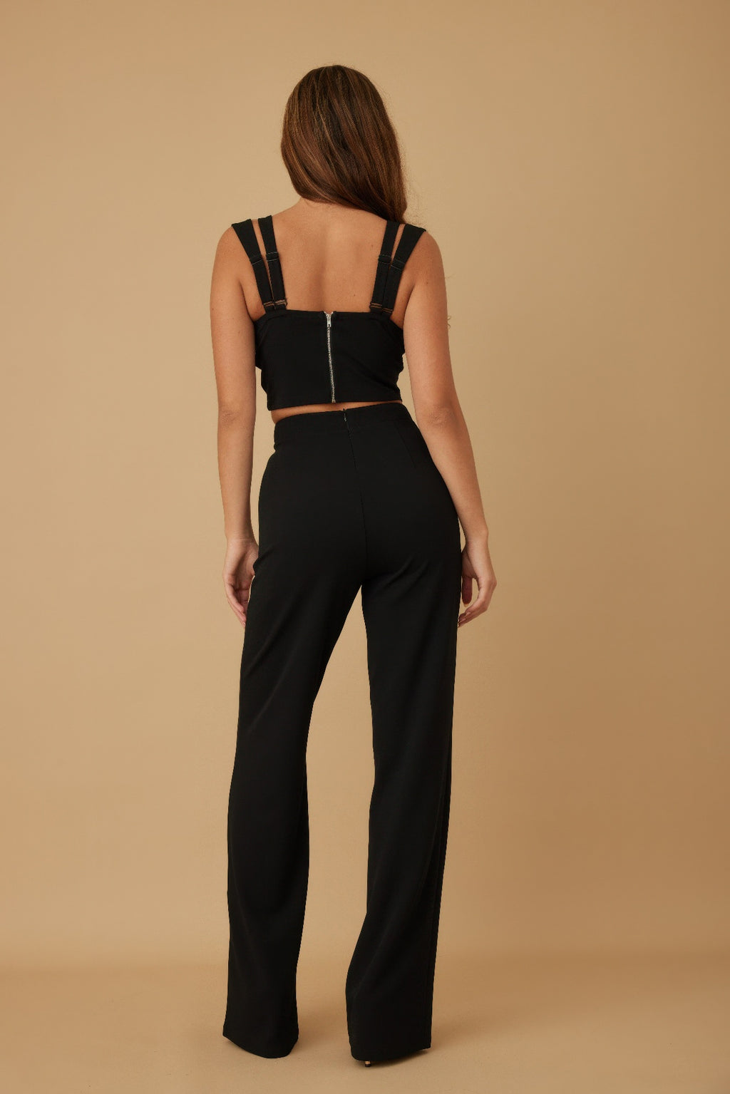 Black wide-leg pants and crop top with back ribbon bow straps
