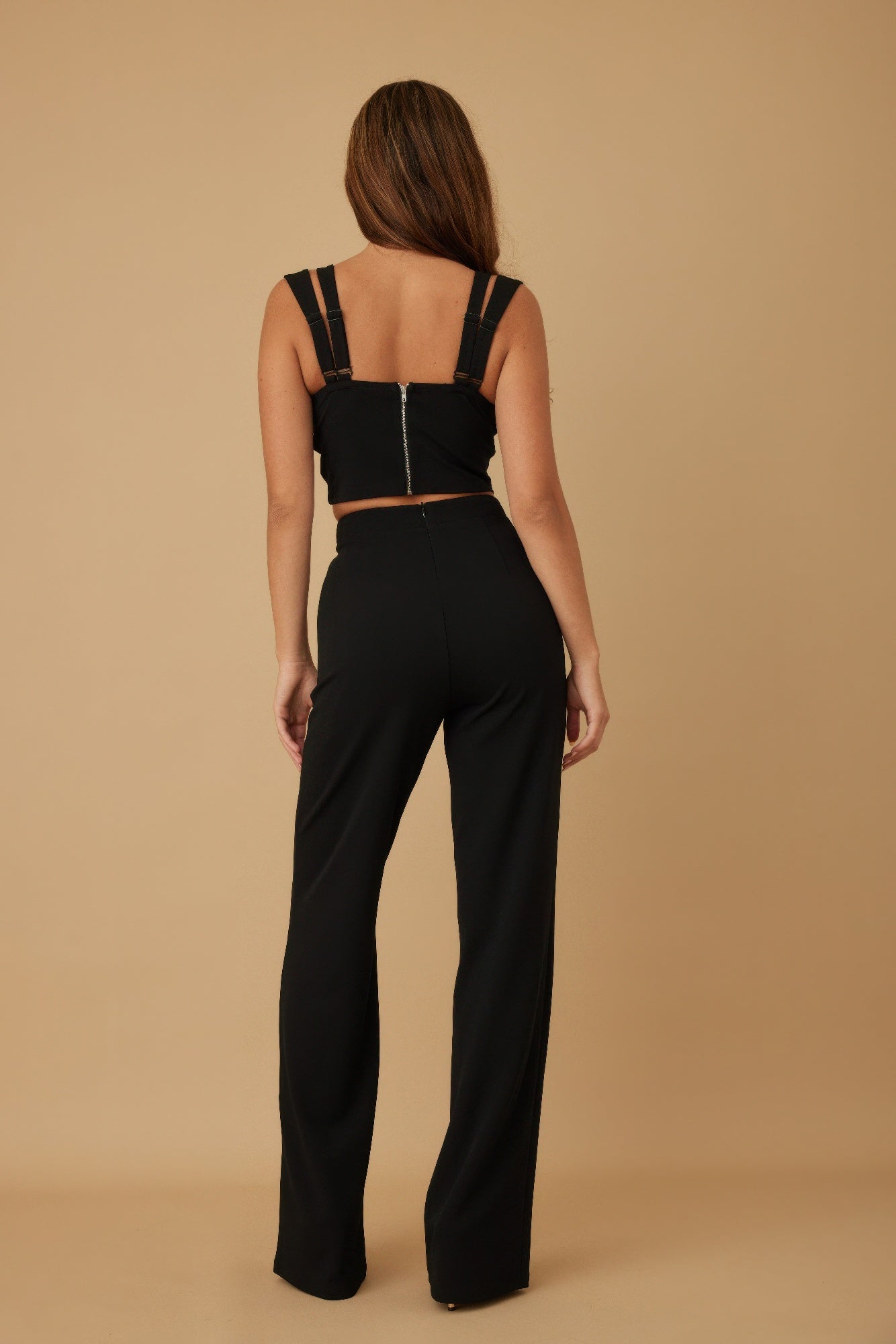 Black wide-leg pants and crop top with back ribbon bow straps