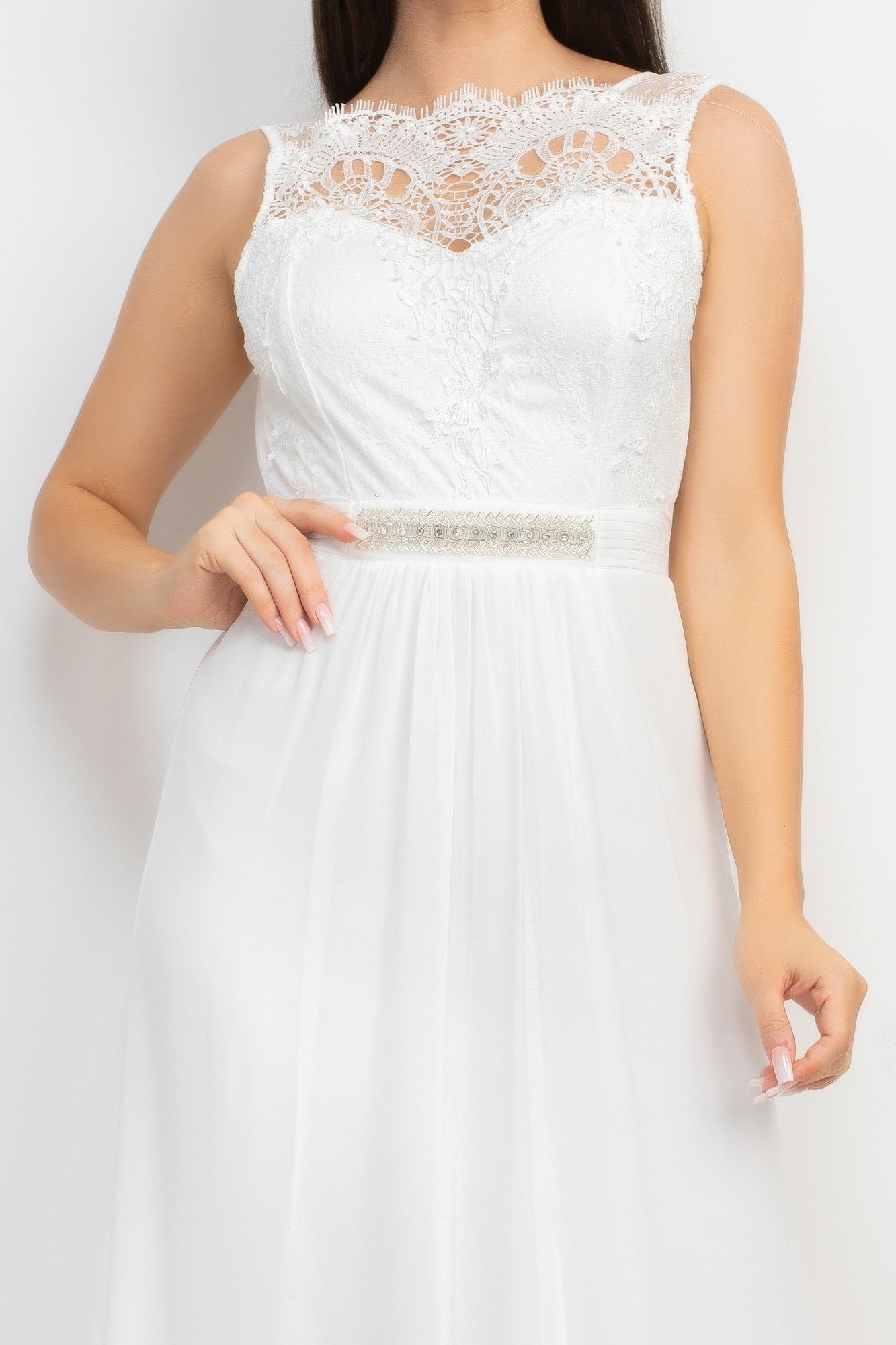 Close-up: white lace bodice with jewel waist belt detail on maxi dress
