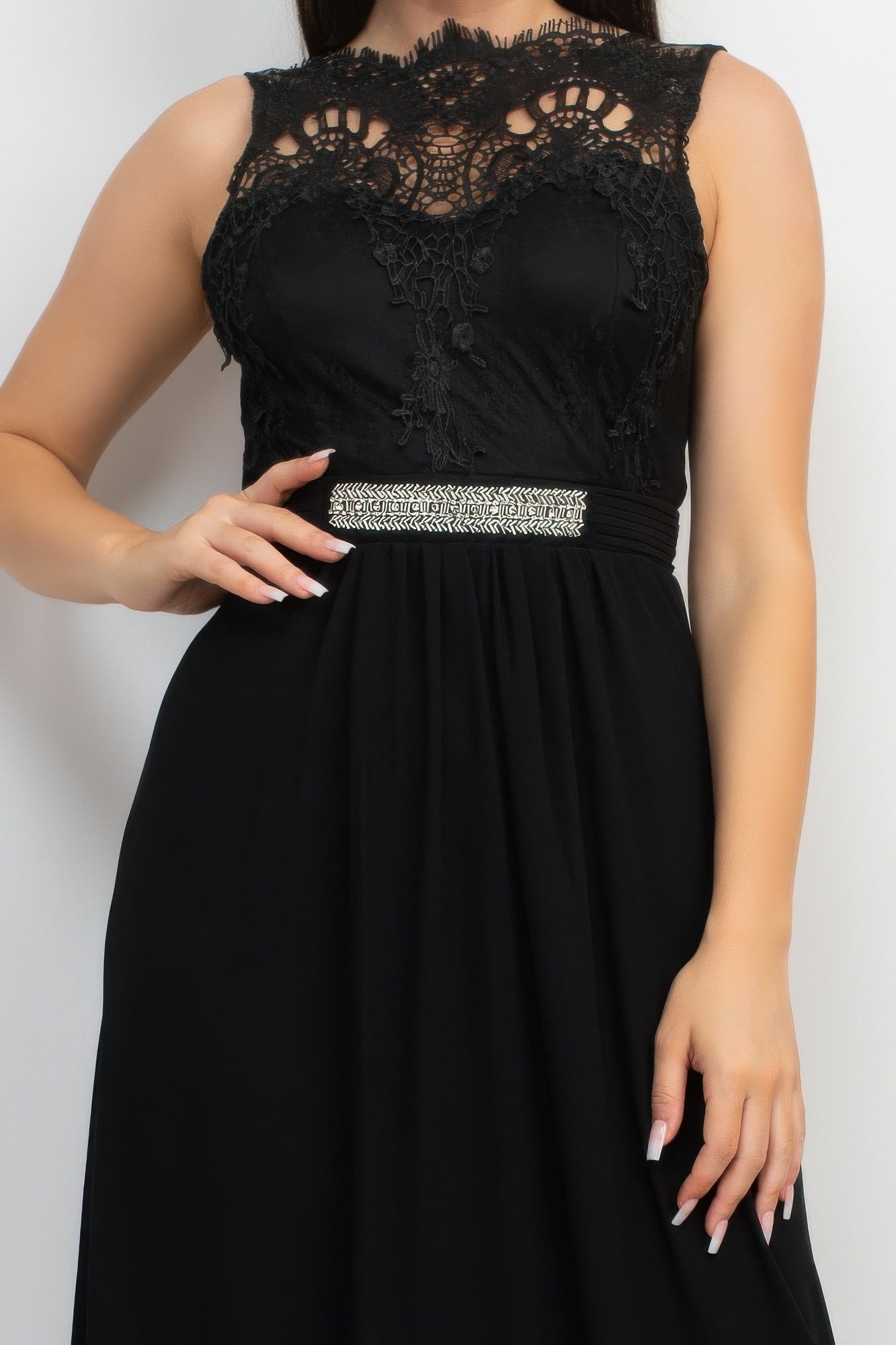 Close-up: black lace bodice with jewel waist belt and pleated waist detail