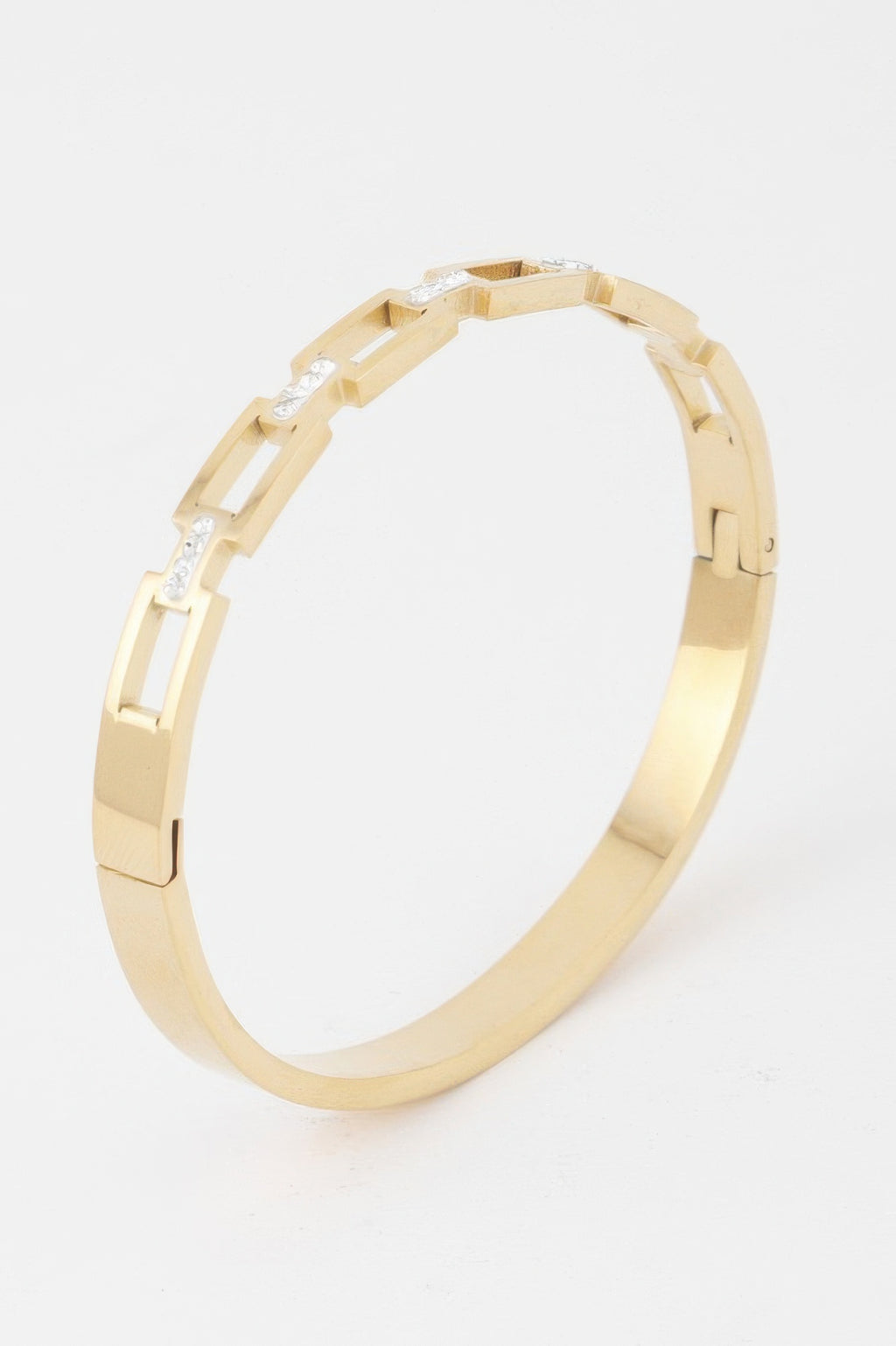 Gold-tone jeweled chain clasp bracelet with clear stones on links