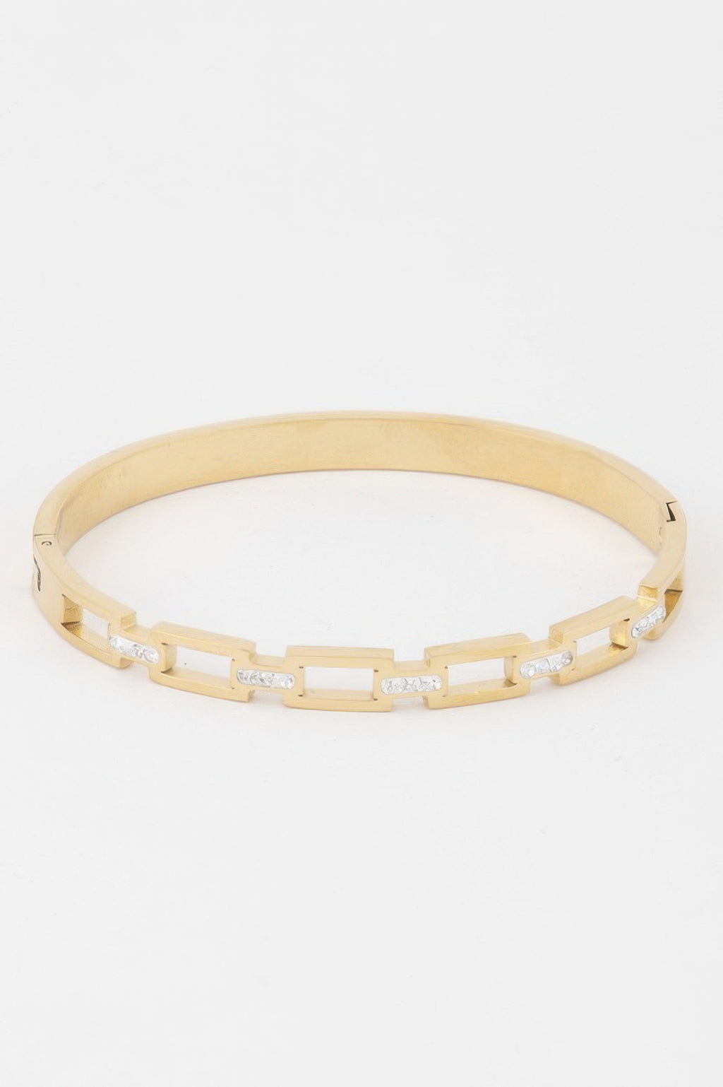 Gold-tone bracelet with hinged chain links and small clear stone accents