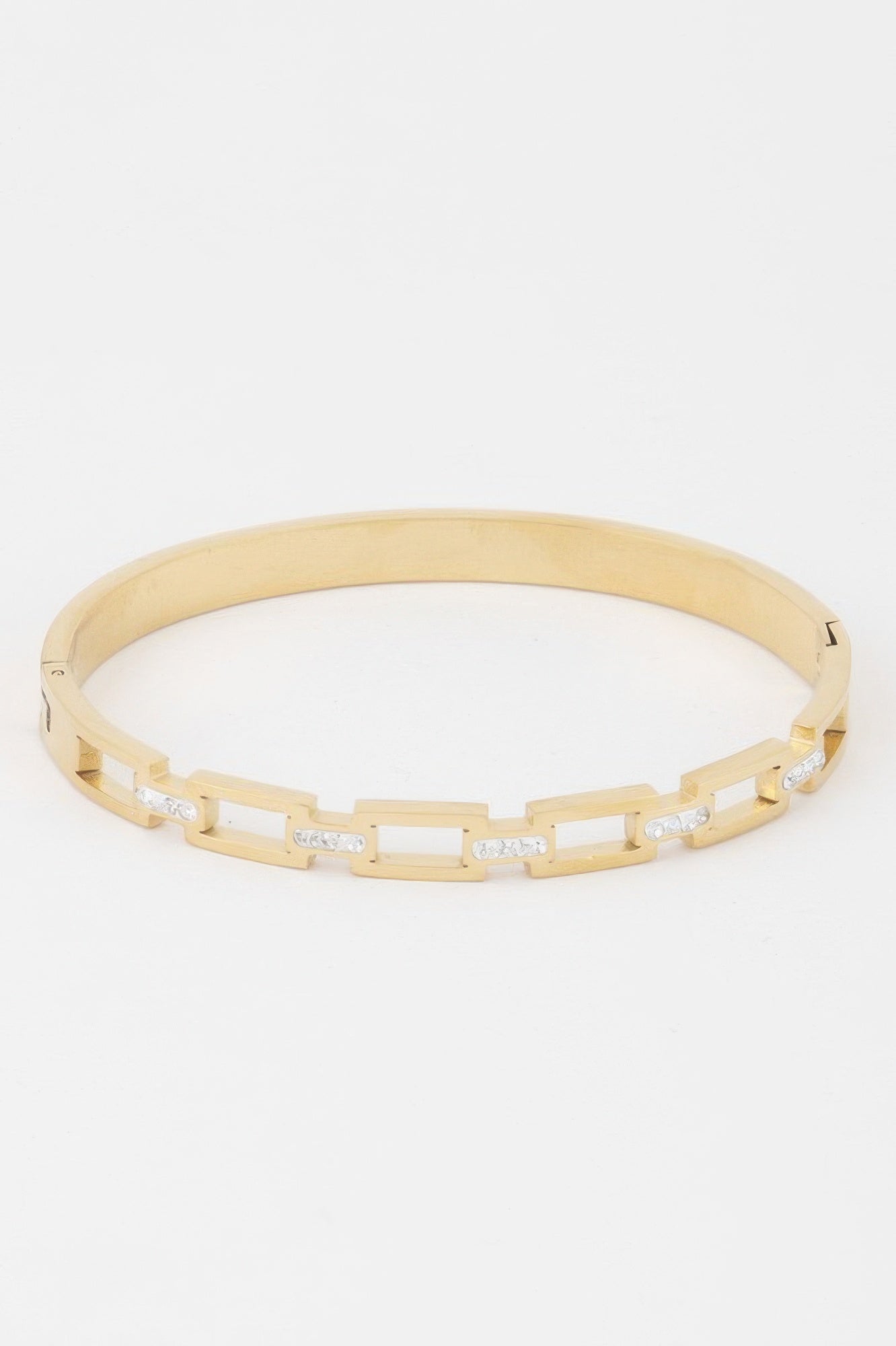 Gold-tone bracelet with hinged chain links and small clear stone accents
