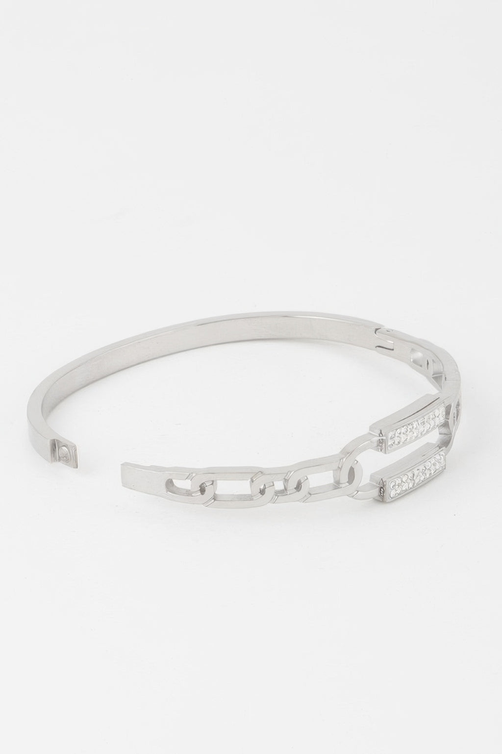 Silver curb chain bracelet with jeweled rectangular clasp, hinged opening