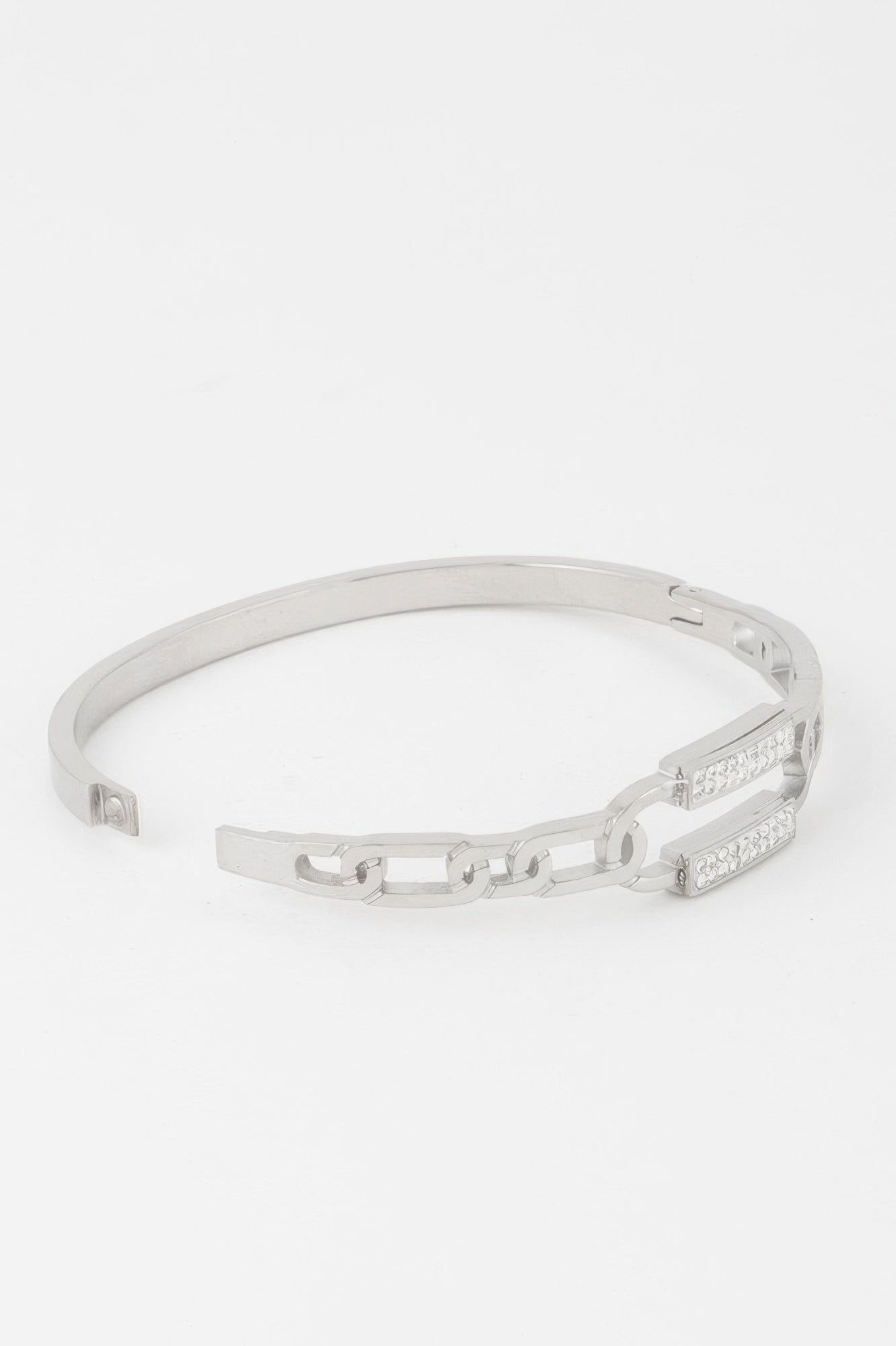 Silver curb chain bracelet with jeweled rectangular clasp, hinged opening