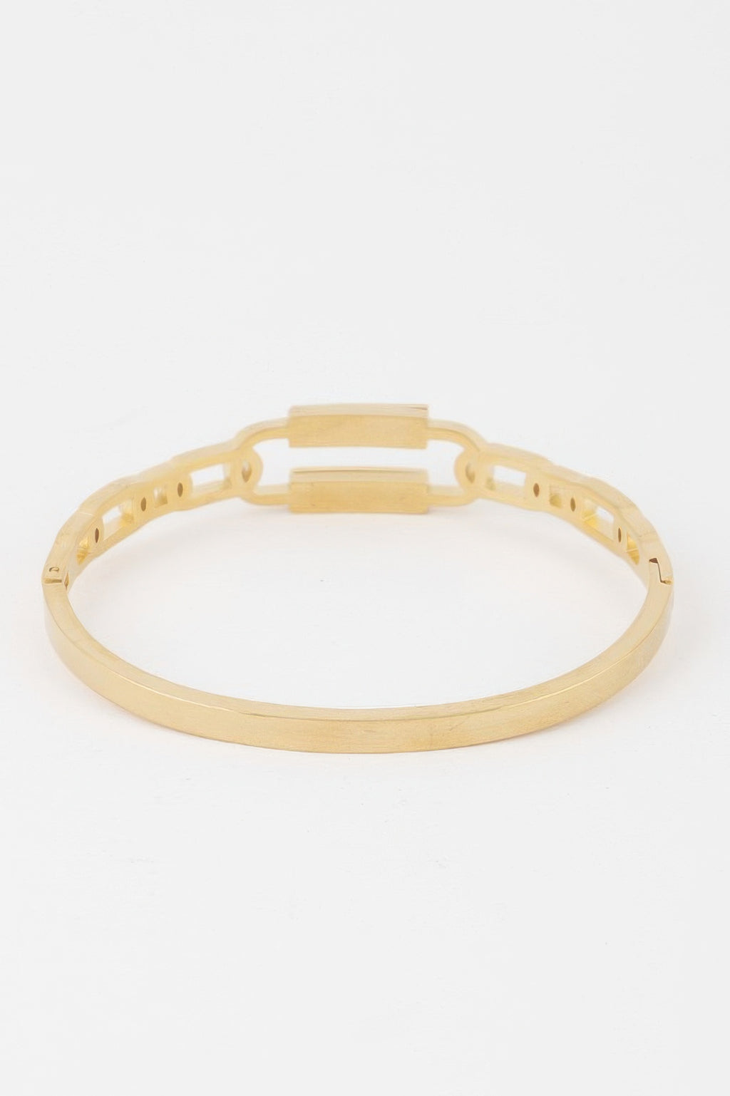 Gold curb chain cuff bracelet with open bar clasp and cutout links