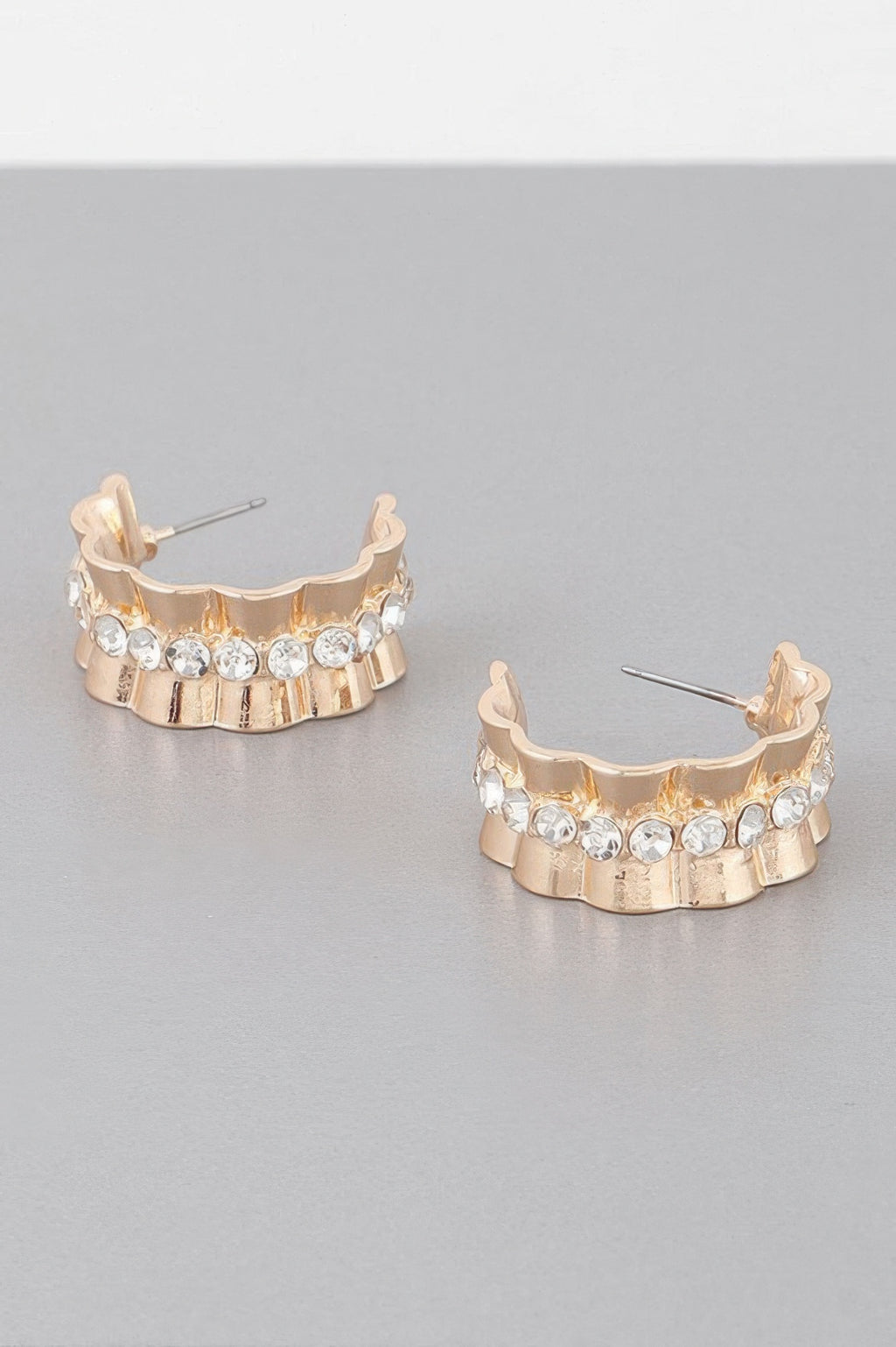 Jeweled lace hoop earrings in gold tone with clear round stones