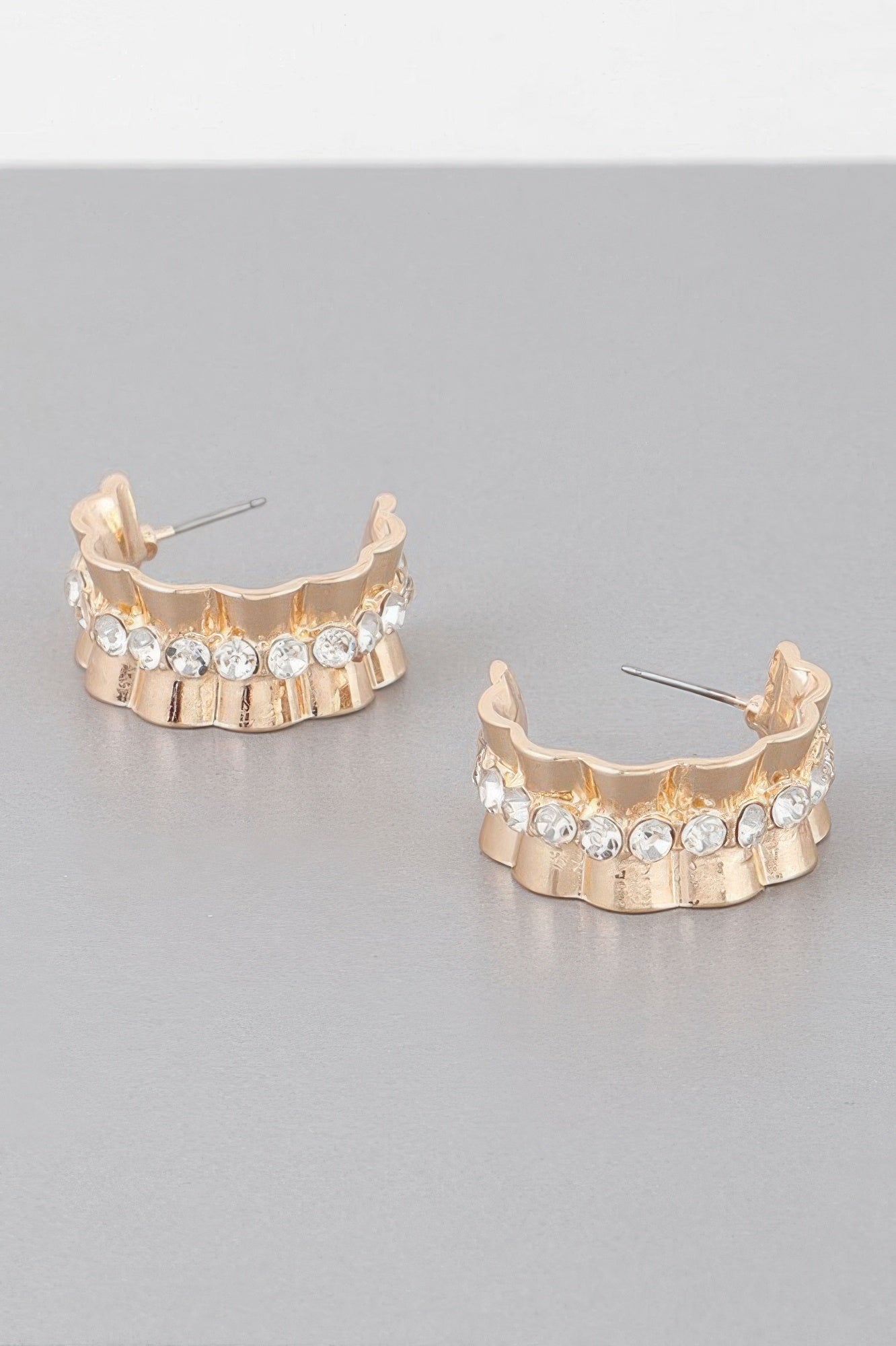 Jeweled lace hoop earrings in gold tone with clear round stones