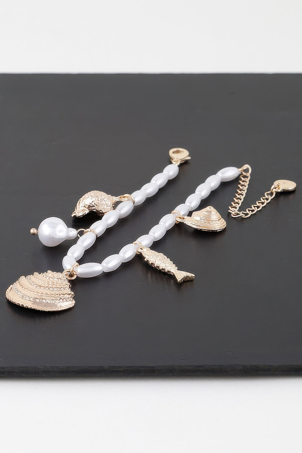 Jeweled Under The Sea bead bracelet with white links and gold fish + shell charms