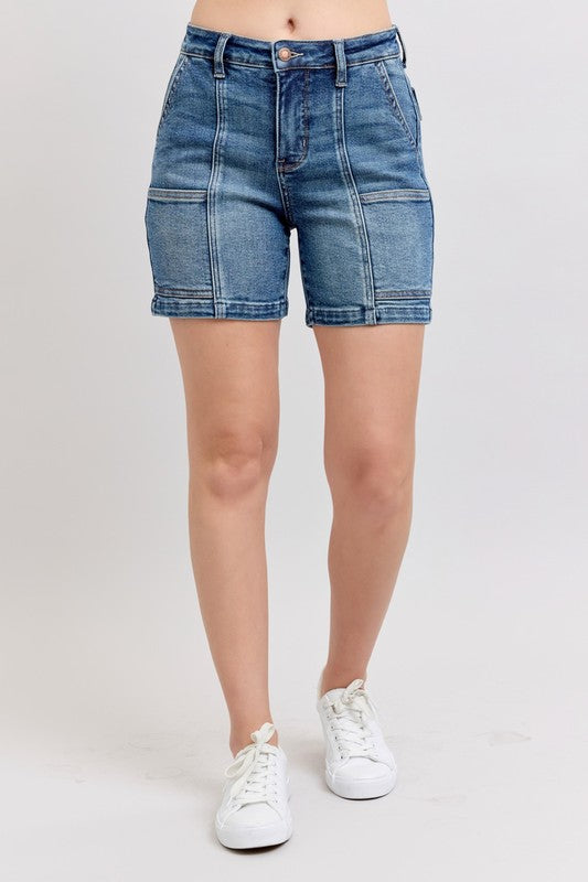 High-rise medium-wash denim shorts with button fly and stitched front pockets