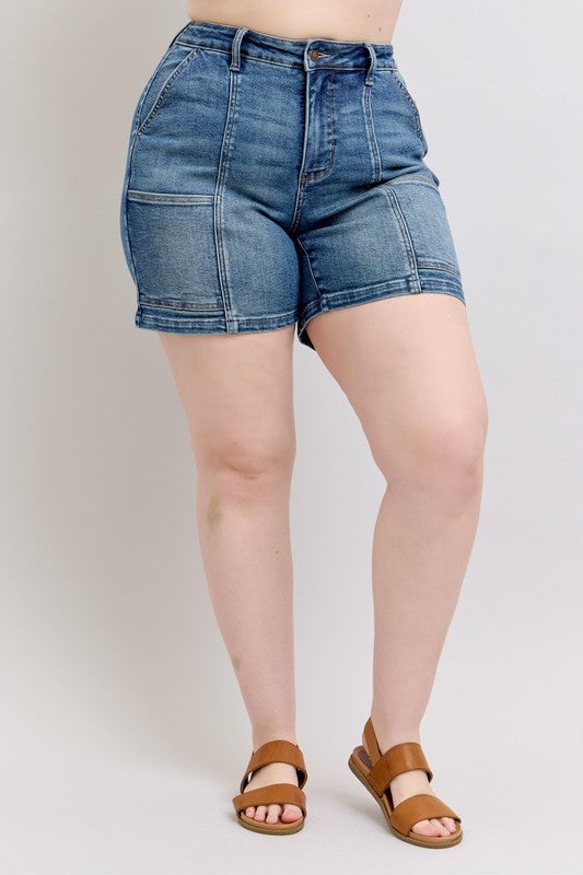 High-rise medium-wash denim shorts, button fly, front patch pocket and belt loops