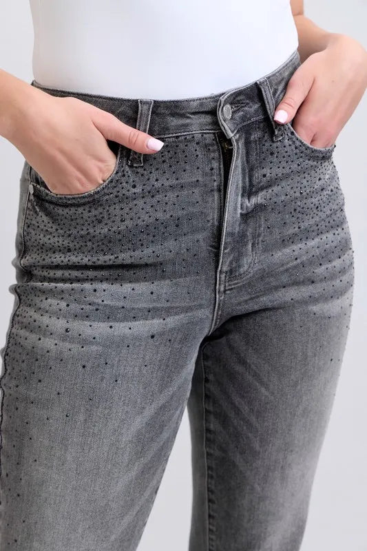 Gray jeans waistband and front pockets with rhinestone speckled pattern