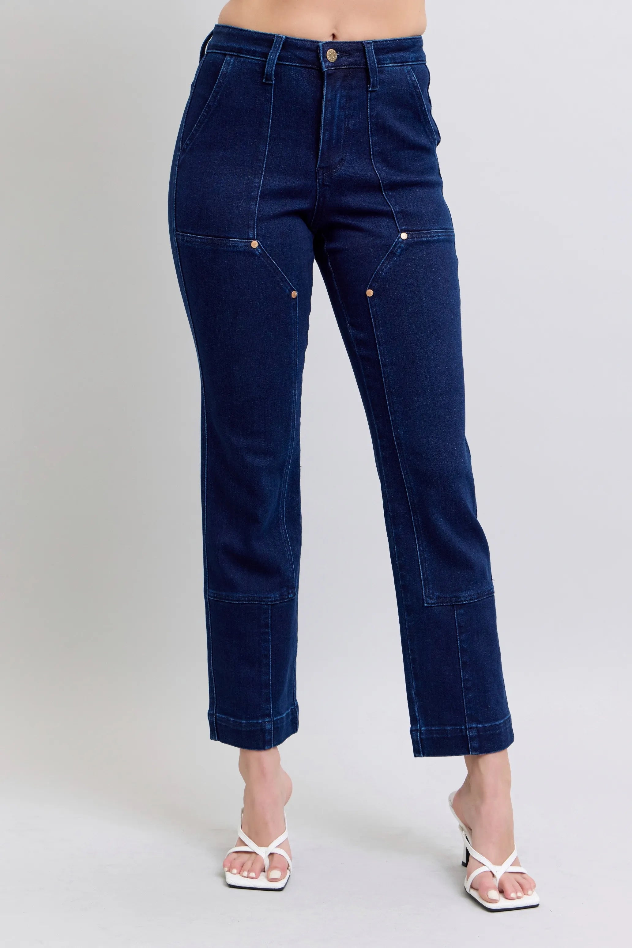 Dark blue straight jeans with knee patch, full size fit, button-zip front.