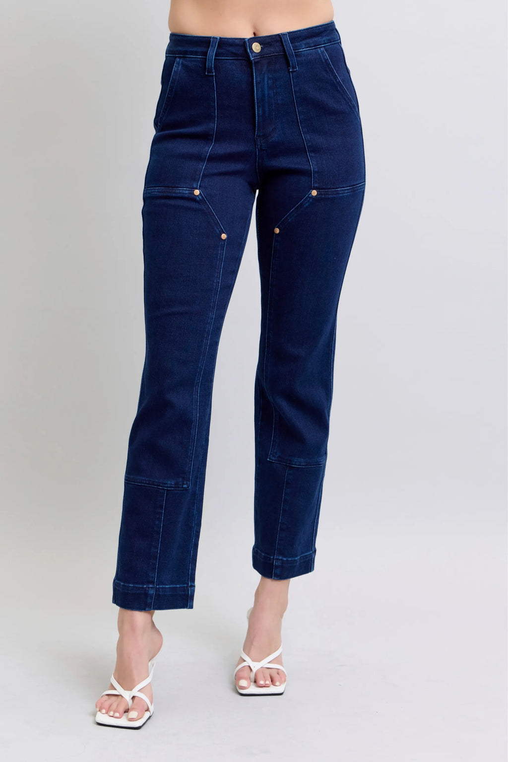 Dark blue straight jeans with knee patch, back view, cropped ankle length.