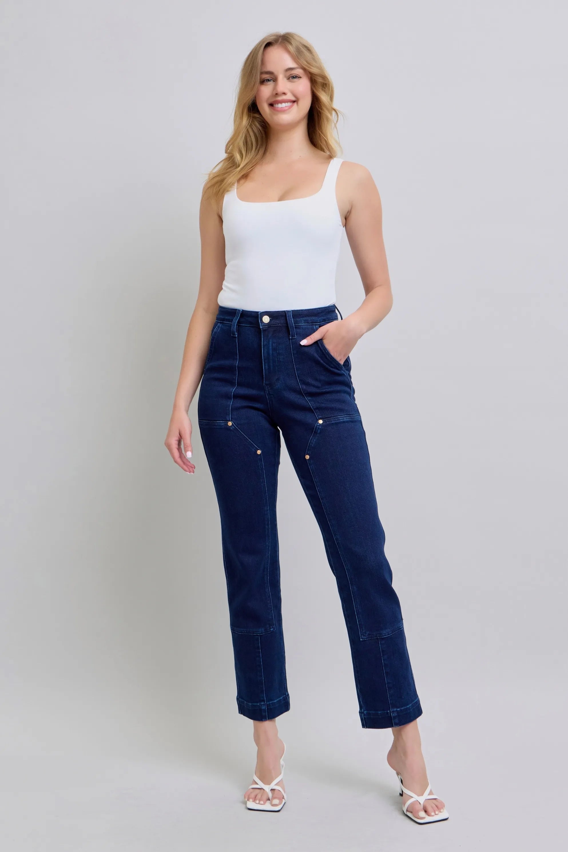 Dark blue straight workwear jeans with knee patches, plus-size cuffed hem.