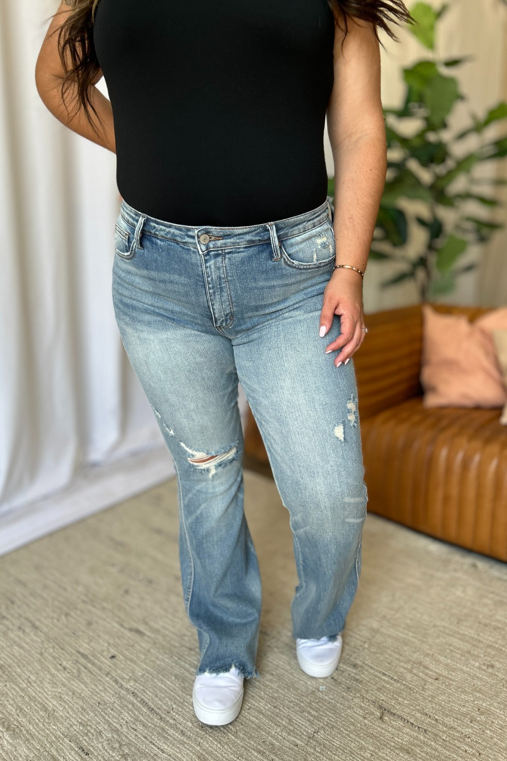 Light-wash destroy flare jeans, mid-rise fit with patchy ripped detailing
