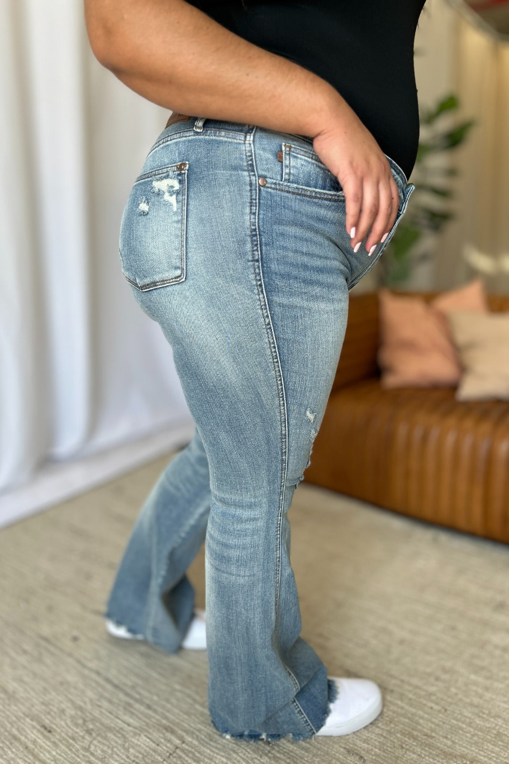 Medium-rise tummy-control destroy flare jeans, light wash, ripped flare hem
