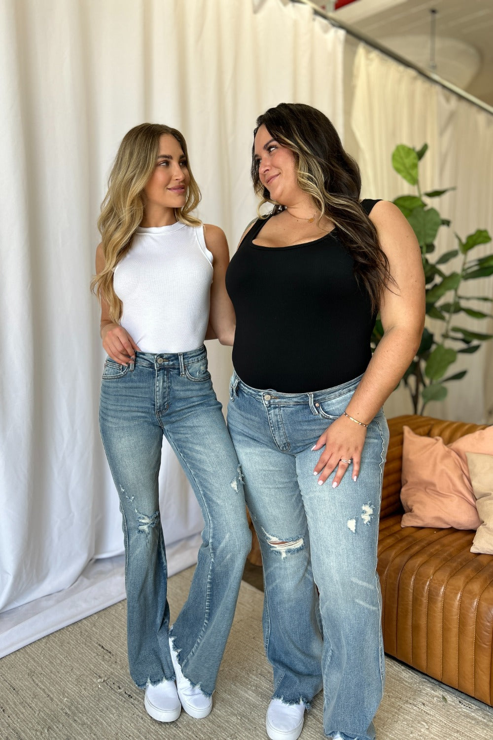 Medium-rise destroy flare jeans, light-wash denim with ripped knees and flared silhouette