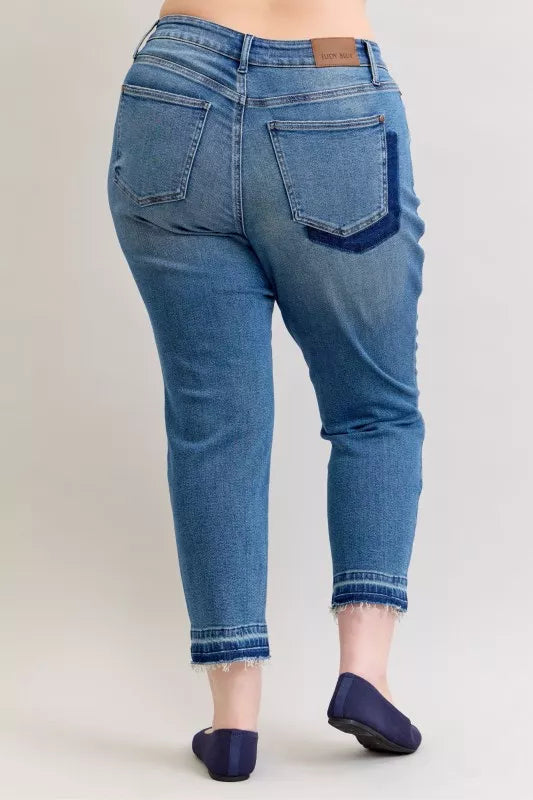 Plus size mid-rise boyfriend jeans in medium wash, patch & repair, released hem
