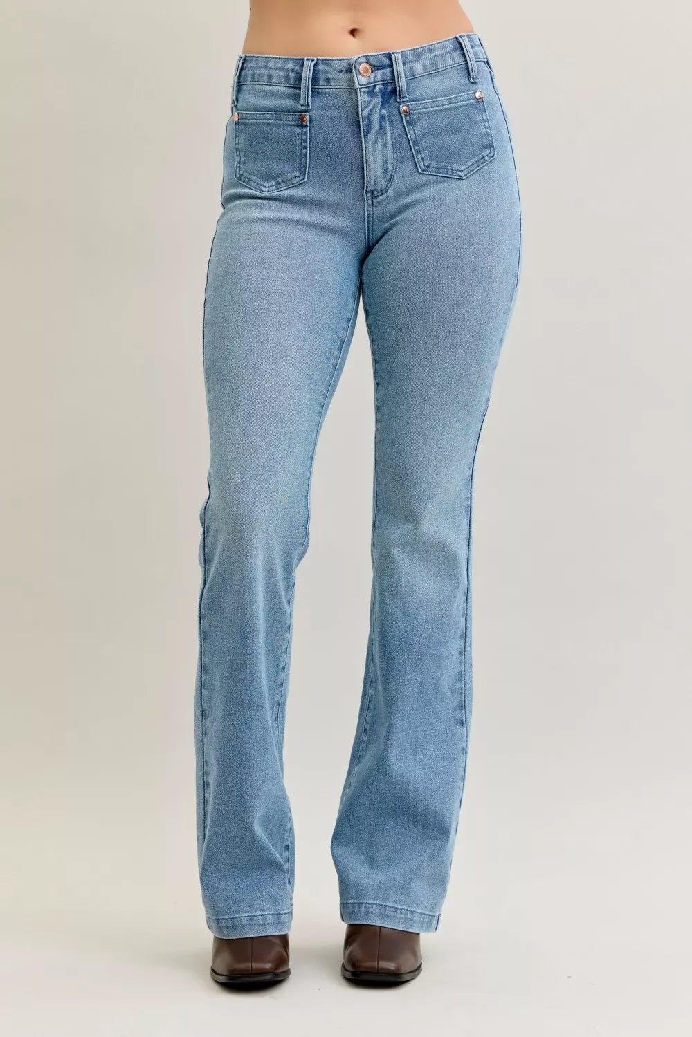 Light blue mid-rise bootcut jeans with front patch pockets and contrast wash