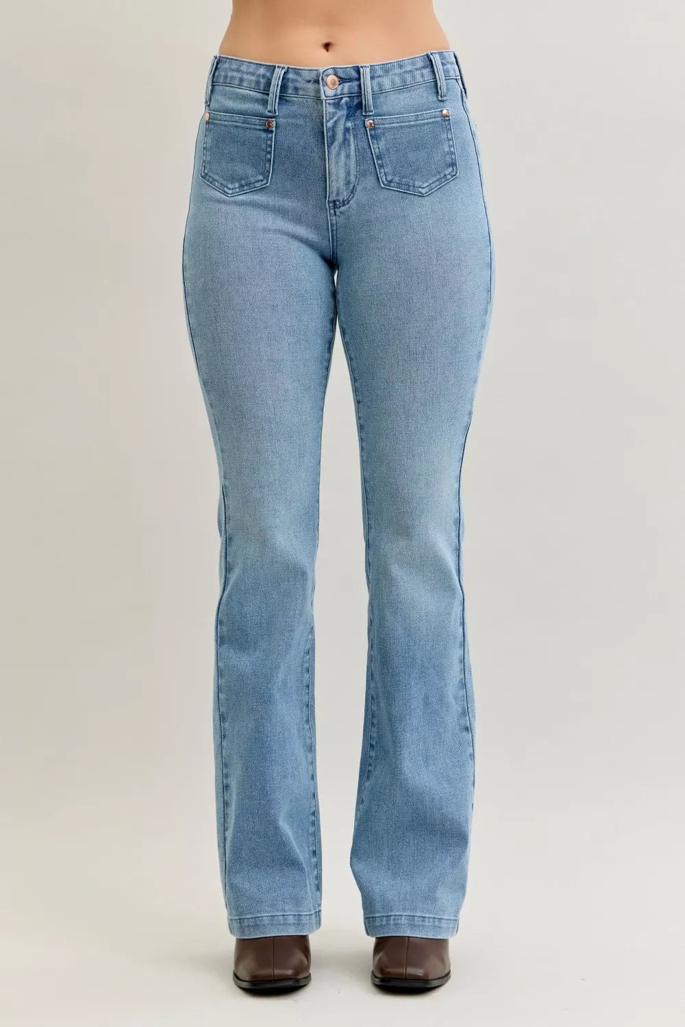 Light blue mid-rise bootcut jeans, front view, patch pockets with contrast wash