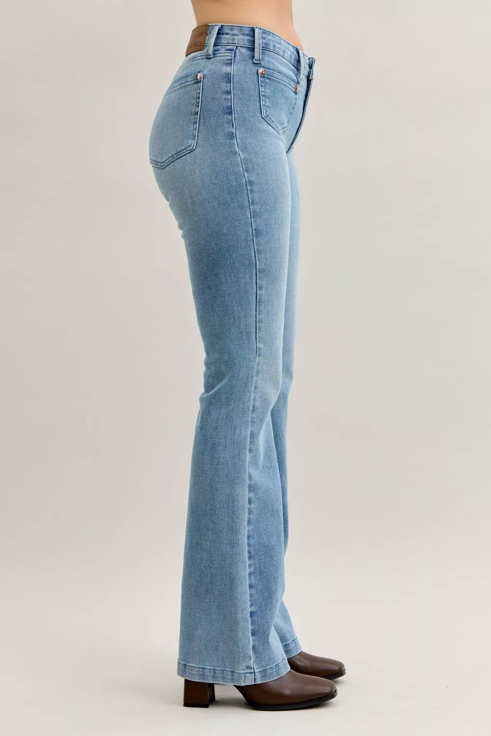 Light blue mid-rise bootcut jeans, back-side view, contrast wash and back yoke
