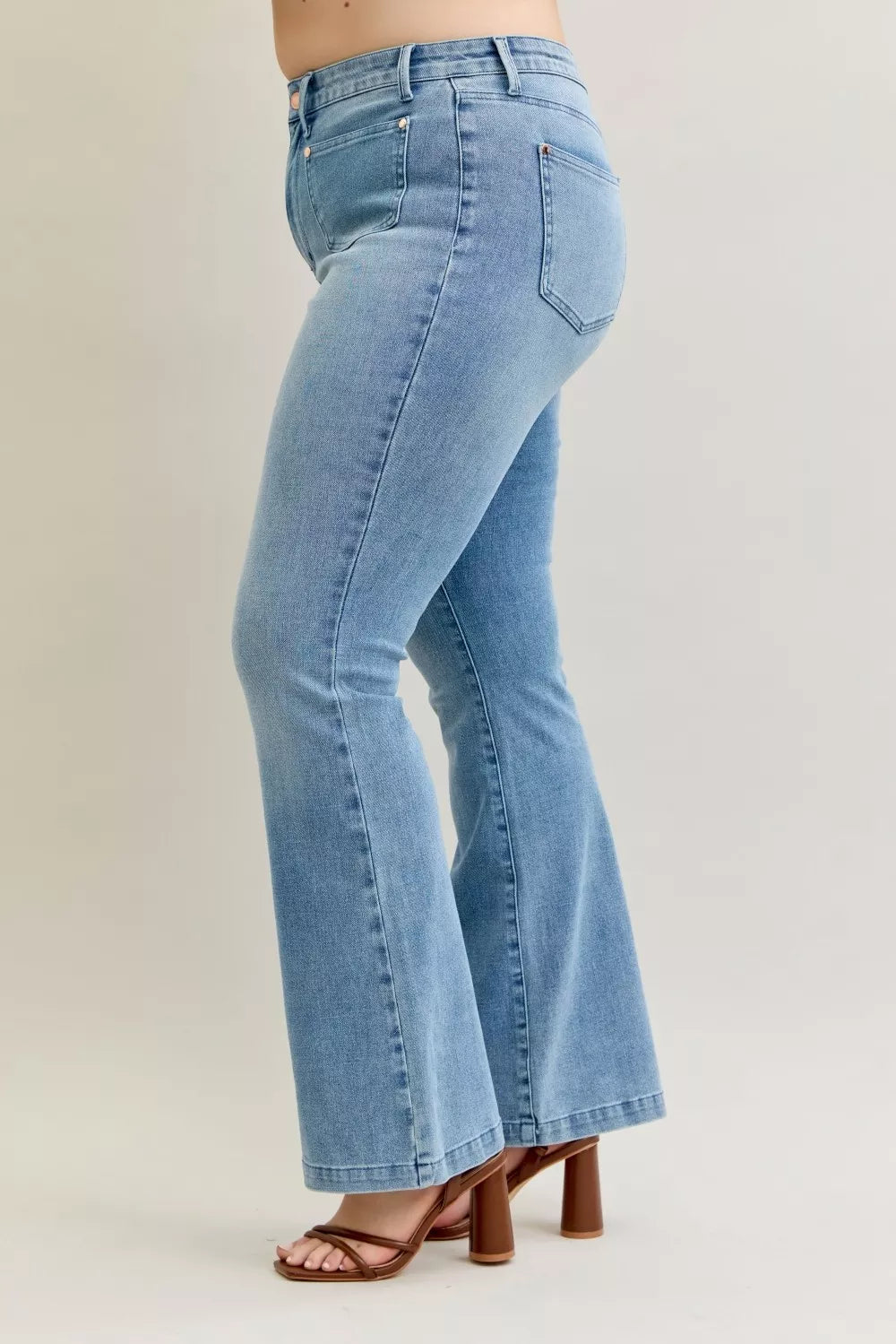 Light wash mid-rise bootcut jeans, back seam detail and patch pockets