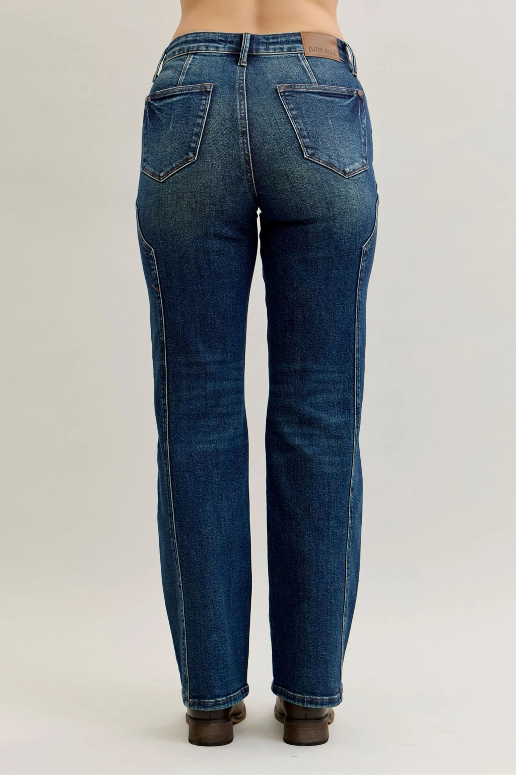 Dark denim plus-size jeans with back yoke and stitched panel seams