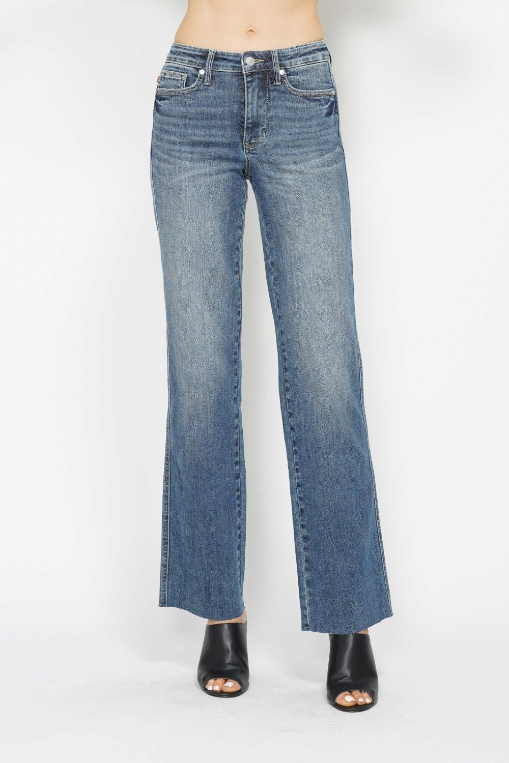 Medium-wash straight jeans with button-and-zip fly, five-pocket design, front view