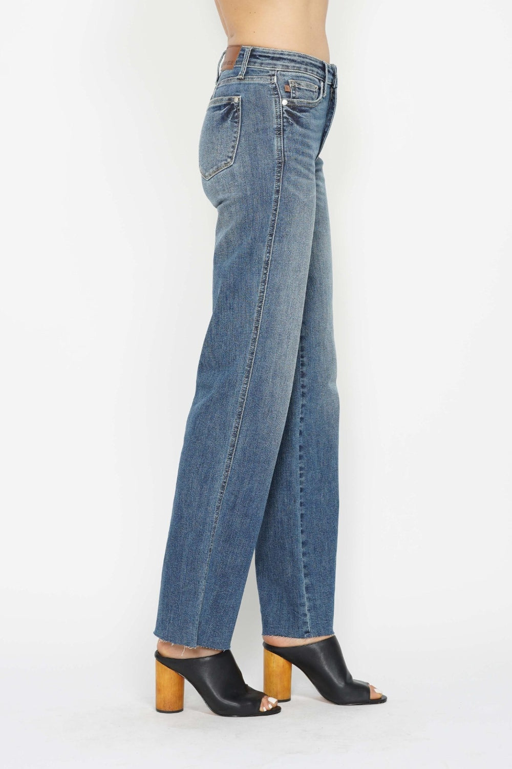 Medium-wash straight jeans, back side view with patch pockets and straight leg hem