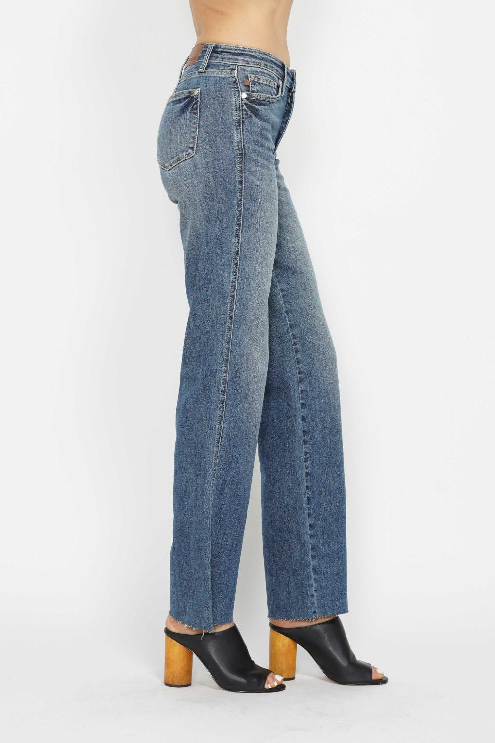 Medium-wash straight jeans, angled back side view with belt loops and patch pocket