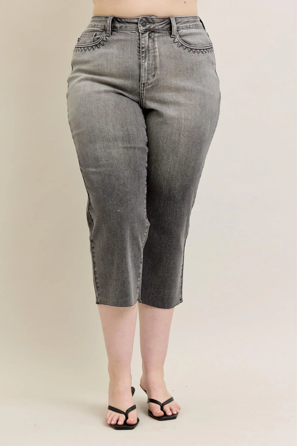 Gray wide-leg capri jeans, front view with zipper fly and stitched front pockets