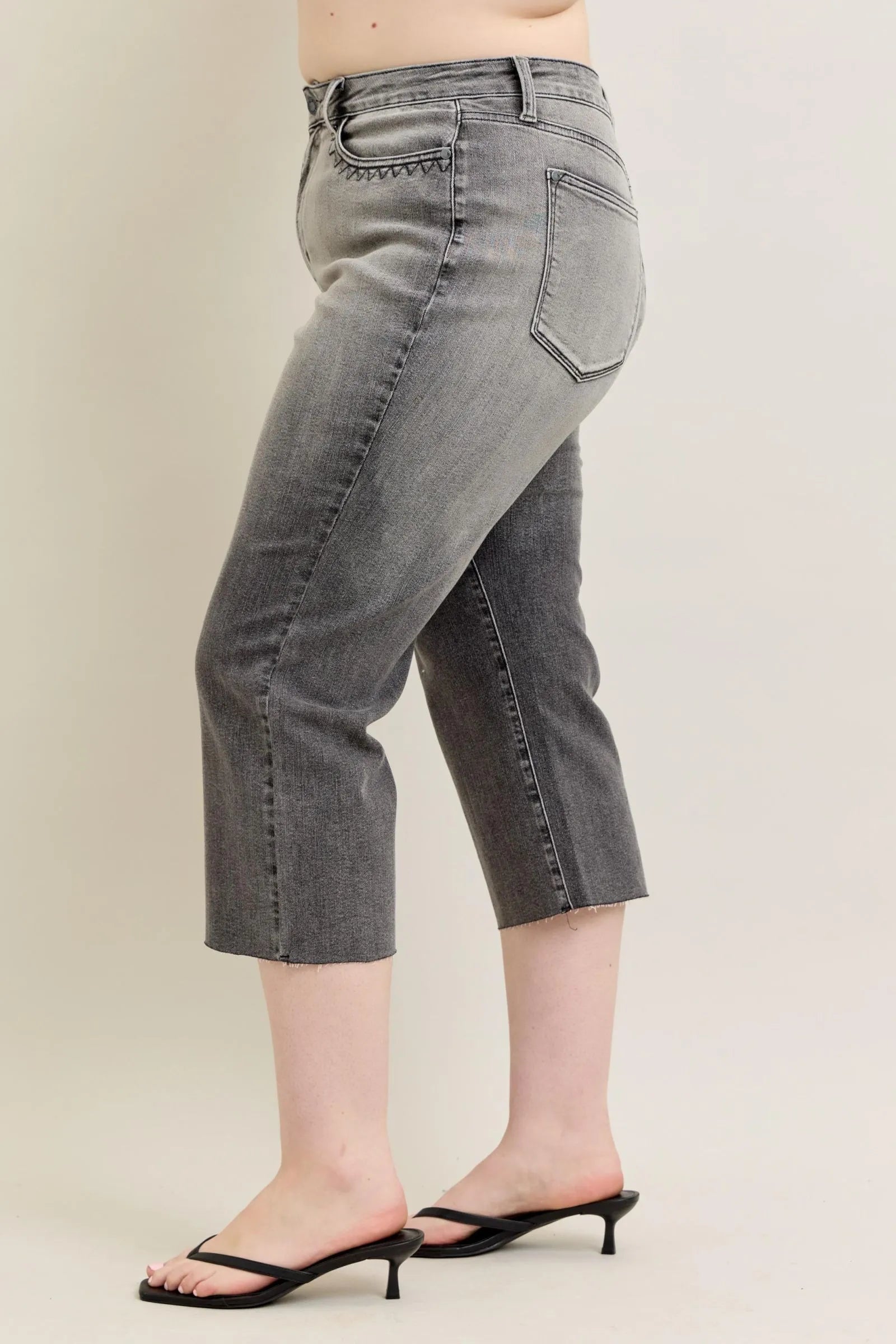Gray wide-leg capri jeans, side profile with button closure and belt loops